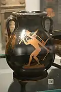 Pelike which depicts a boy carrying furniture for a symposium (drinking party), in the Ashmolean Museum (Oxford, UK)