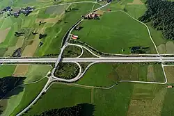 A parclo AB2, or folded-diamond interchange along Bundesautobahn 7 in Germany 47°38′28.68″N 10°31′40.08″E / 47.6413000°N 10.5278000°E / 47.6413000; 10.5278000