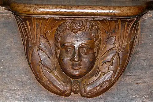Misericorde or resting spot on a seat back in the choir