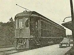 A streetcar-like electric railcar at a train station