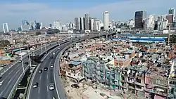 Slum housing next to motorway
