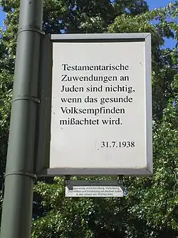 Sign which reads: "Testamentary donations to Jews are null and void if the healthy sentiments of the people are disregarded."