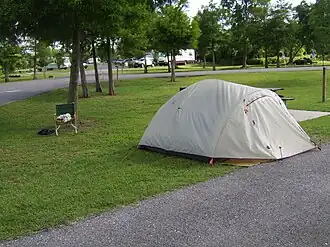 A grey tent set up on Bayou Segnette park grounds