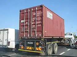 20 foot shipping container on the back of a truck​​‌