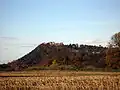 Beeston Castle viewed from the south, built on a rocky summit 110 m (360 ft) above the Cheshire Plain