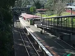 Eastbound view of Platform 1 and the station building, July 2014