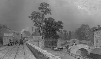 Berkhamsted railway station in 1838 with the Grand Junction Canal to the right[14]