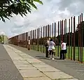 Poles mark where the Wall once stood along Bernauer Straße.