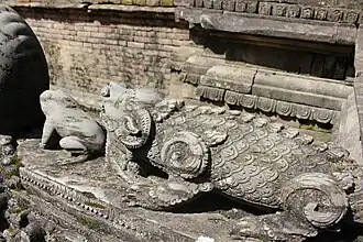 Stone lid on the spout of Layaku Hiti in Bhaktapur