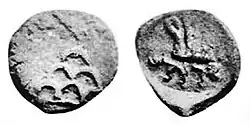 Coin of Agathocles. Obv Stupa surmounted by a star, Kharoshthi legend Akathukreyasa "Agathocles". Rev vegetal symbol and hirañasame (185-168 BCE).[10]