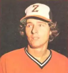 A man in a black and white baseball cap with an orange brim with a "Z" insignia on the front