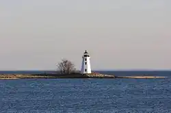 A black and white photograph of Black Rock Harbor Light