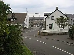 A road junction with houses either side