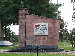 This memorial in Blievenstorf of the death march from Sachsenhausen concentration camp includes a red triangle emblem