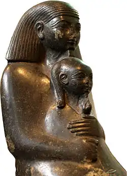 Princess Neferure as a girl, sitting on the lap of her tutor Senenmut. Girls and women in Ancient Egypt enjoyed a relatively high social status.