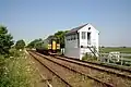 Blotoft signal box (Helpringham)with a Class 153 unit passing.[38][page needed]
