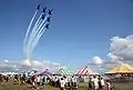 The Navy's Flight Demonstration team, the Blue Angels, perform their delta formation during the Indianapolis Air Show.