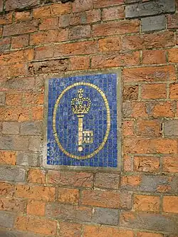 The Post Office Savings Bank logo in mosaic on the east wall of Blythe House