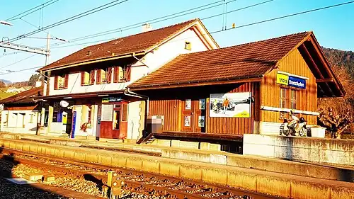 Two-story station building with single-story wings