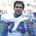 Headshot of Bruce Matthews on a football field wearing his uniform but no helmet