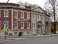 Historical campus building in Buffalo, NY with old Bryant & Stratton Business Institute sign.