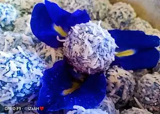 Blue-coloured buah melaka, naturally dyed with bunga telang (butterfly pea flower)