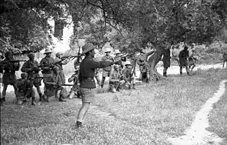 Paratroopers preparing to open fire; Horst Trebes in front