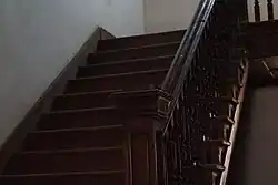 The mahogany wooden staircase of Burdwan House.
