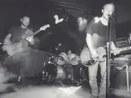 Album booklet image (black and white version). From left to right, Forrest Orr, Tim Harris, Brett Nelson.