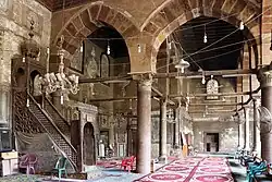 Prayer hall of the mosque, with minbar visible (left)
