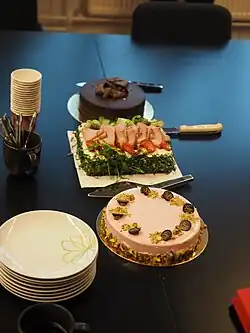 A smörgåstårta between two sweet cakes