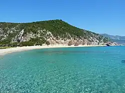 Cala Luna [it] in the Province of Nuoro in Sardinia was the location of Andrea's postcard.