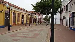 A street with single-storied colorful houses
