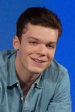 A 28-year-old man with short brown hair, smiling.