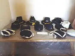 Military hats worn in Fort Verde