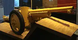 A Canon de 75 modèle 1897 field gun modified for motor traction with pneumatic tires. The device beneath the barrel was the hydro-pneumatic recoil mechanism.