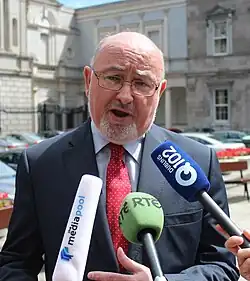 Caoimhghín Ó Caoláin speaking to press 2013 crop.jpg