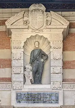 The upper part of the portal (1602-1609) features a statue of King Henry IV