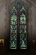 Art Nouveau stained glass in the nave with adjacent Georgian icons.
