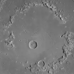 Central peak ring. Concentric troughs are visible.