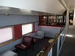 Inside view of the Santa Fe-Plaza Taos Dome Car "Lounge Room" .