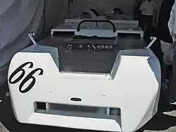 Front view of an open-top sportscar with no headlights