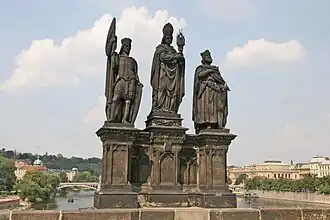 Statues of Saints Norbert, Wenceslaus and Sigismund on the Charles Bridge in Prague. The statue of Saint Norbert is in the middle); on the left is Saint Wenceslas, while on the right is Saint Sigismund.