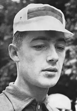 A man wearing a white cap.