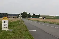 Photograph shows Route D18 CD on the Chemin des Dames with Heurtebise Farm at left.