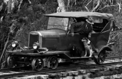 Managers' Chevrolet jigger on a bridge over a gorge near the mill