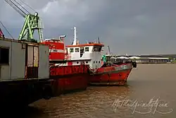 Ships are moored on the bank of Chao Phraya at Chong Nonsi