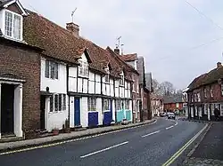 a narrow road flanked by small houses
