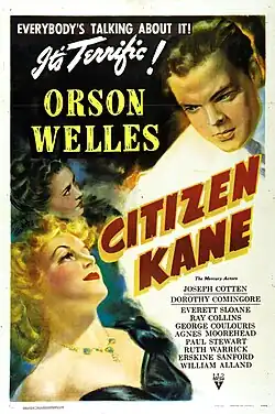 Poster showing two women in the bottom left of the picture looking up toward a man in a white suit in the top right of the picture. "Everybody's talking about it. It's terrific!" appears in the top left of the picture. "Orson Welles" appears in block letters between the women and the man in the white suit. "Citizen Kane" appears in red and yellow block letters tipped 60° to the right. The remaining credits are listed in fine print in the bottom right.