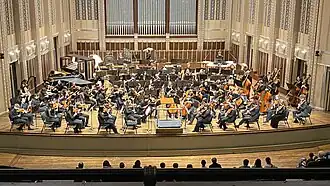The orchestra performing at Severance Hall